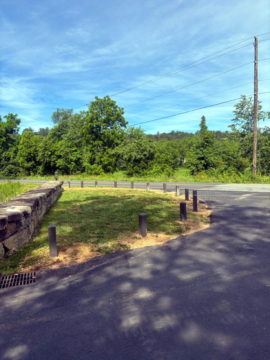 Stone retaining wall along a finished driveway in Western North Carolina